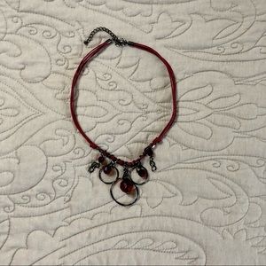 Red costume jewelry necklace.